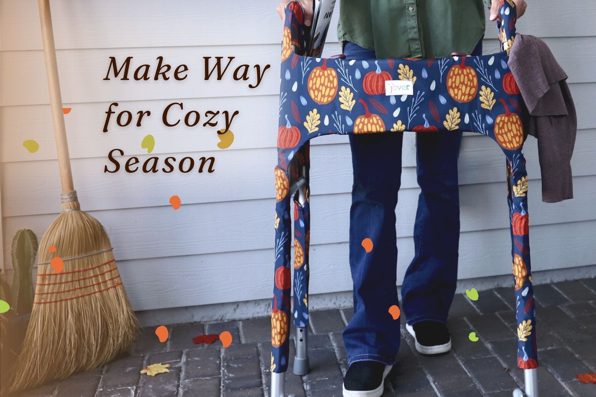 Woman on porch with Fall Festival Jover on standard walker; magazine in inner pocket, sweater in outer pocket with text Make Way for Cozy Season.