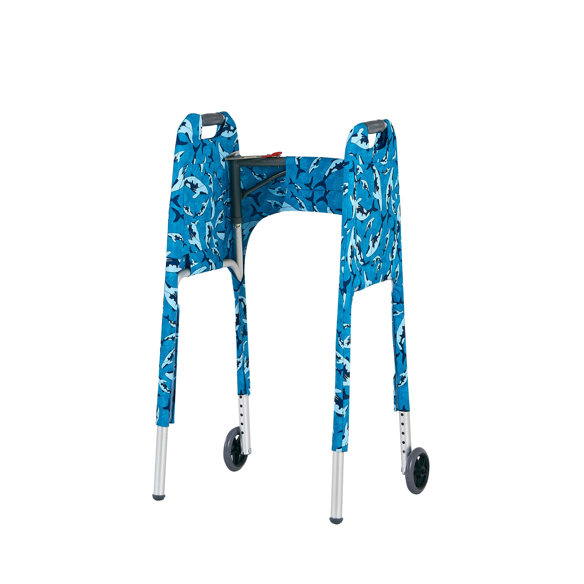 Product photo of the Jover Walker Cover in a swimming whale pattern in shades of blue. Inside view highlights a smaller side pocket and adjustable straps with hook-and-loop "Velcro" closures, allowing the cover to be securely and simply attached to the front wheeled walker.