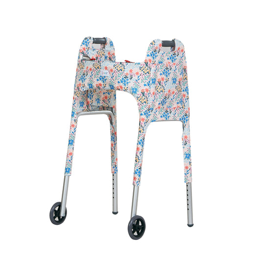 Multi-colored pastel wildflower-print walker cover with pockets on a standard folding walker with wheels on a white background - left 3/4 view.